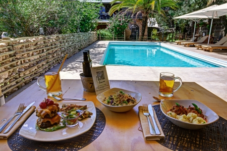 Swimming pool and food at Rooster & Co. Restaurant